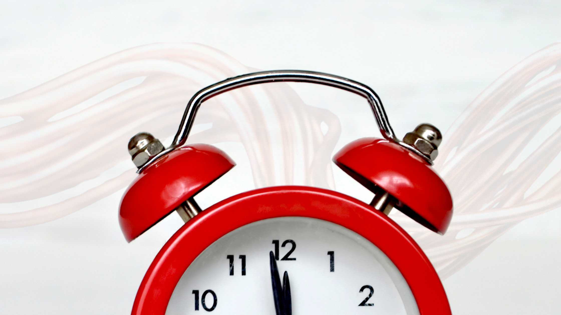 A red alarm clock shows the time near midnight while faded copper wires trail behind it—a visual reminder that the phase-out of Plain Old Telephone Service (POTS) phone lines is here.