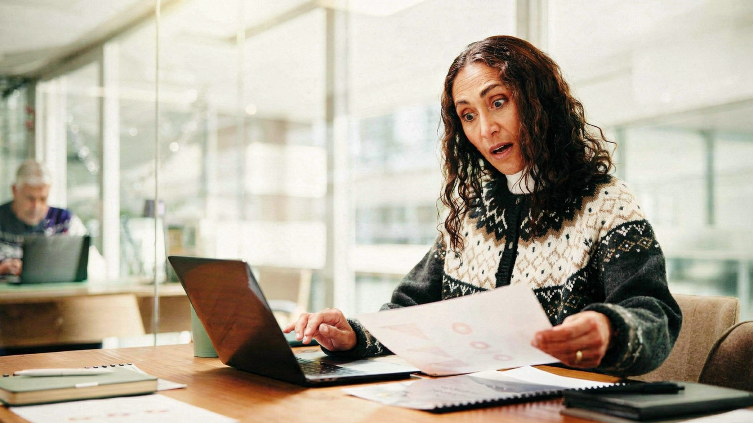 A festive person looking surprised at the significant cost savings that telecom audit services provide.