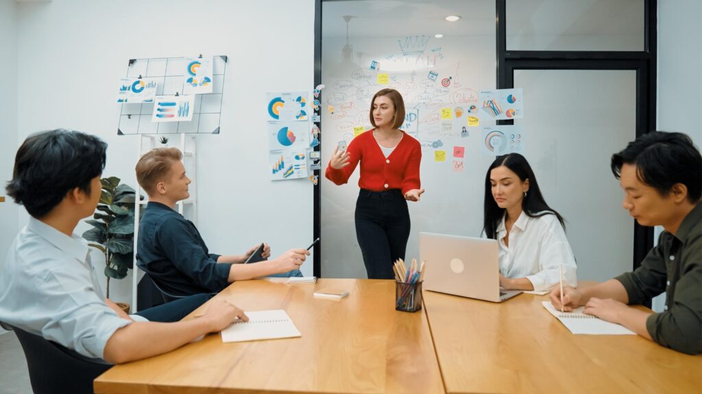 An enteprise team discussing a unified communications service and how it could positively affect their business processes in 2026.
